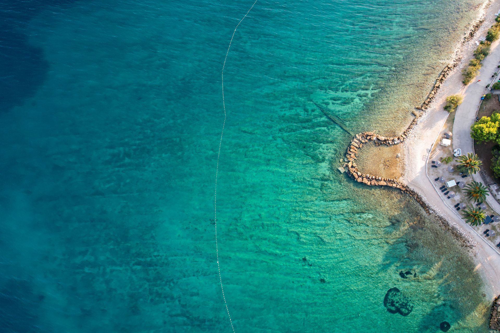 Aerial view of a tropical beach and turquoise water